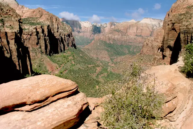 Sandstone ledges in the foreground and the canyon below from Canyon Overlook, Zion National Park.
